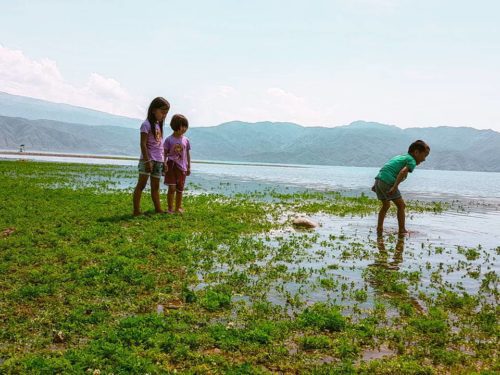 Children playing at Toktogul lake - Kyrgyzstan