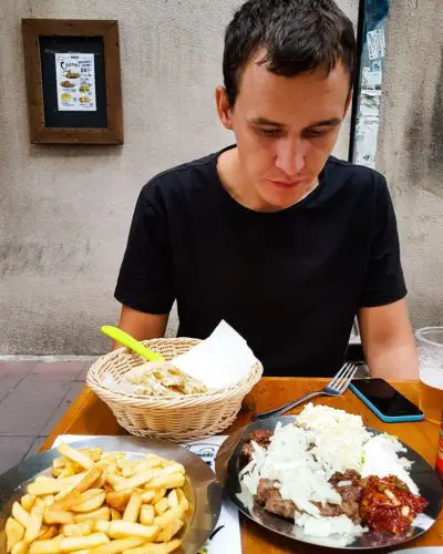 Eating cevapi in Belgrade, Serbia