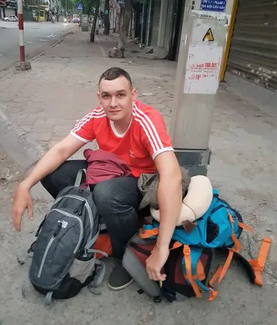 Jake waiting on the corner with our backpacks