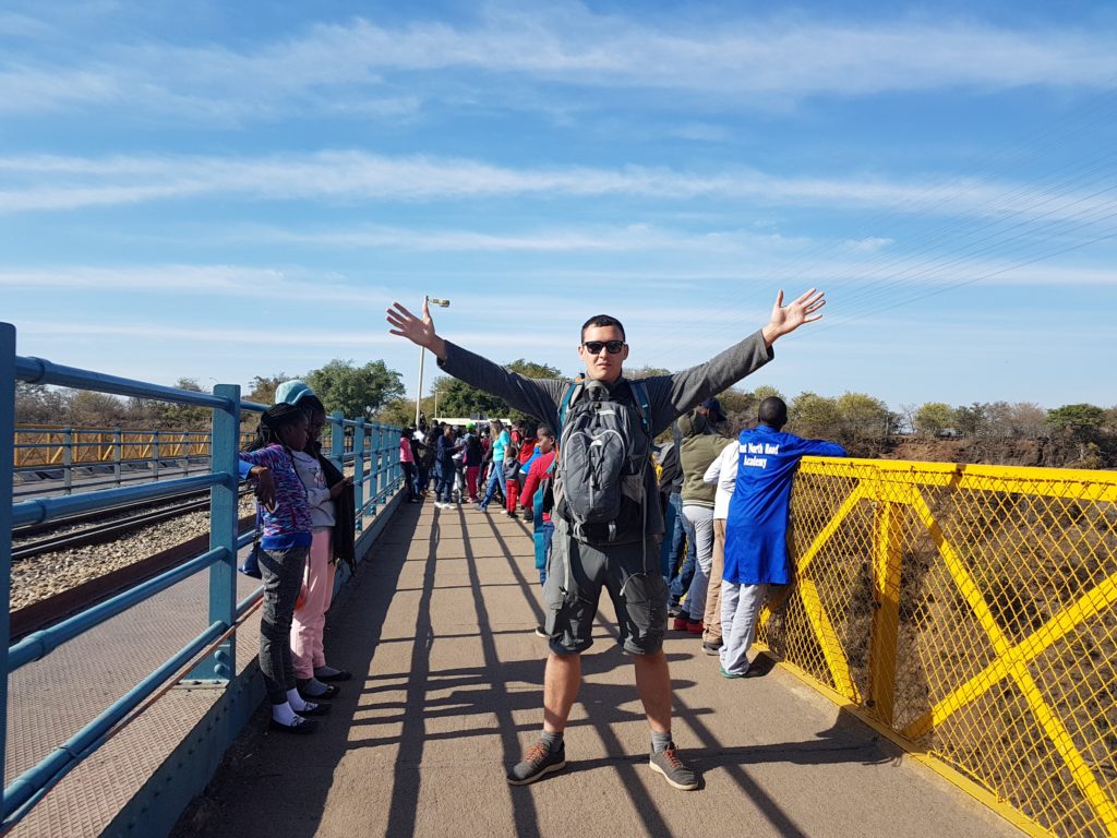 Walking across the bridge that connects Zimbabwe and Zambia