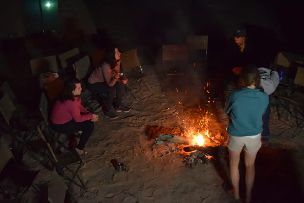 Night around the camp fire on an overland tour in Africa