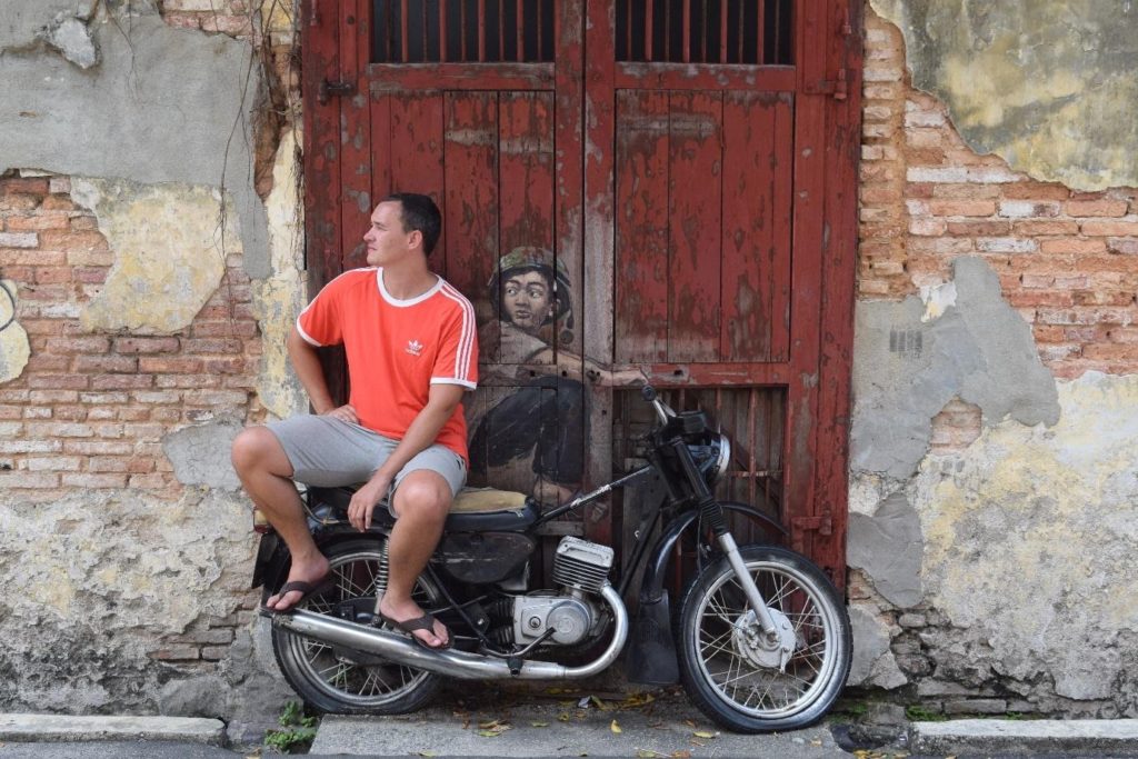 The boy on a motorbike street art in Penang