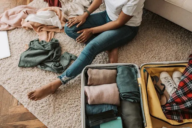 Woman packing a suitcase